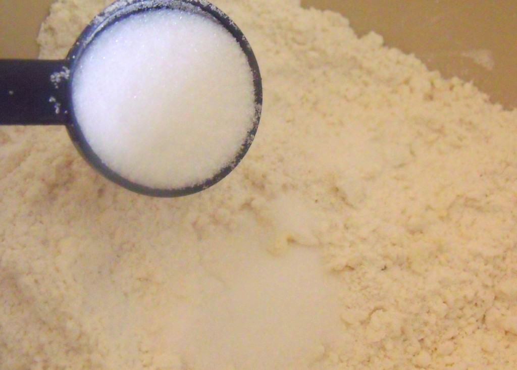 Adding sugar to flour
