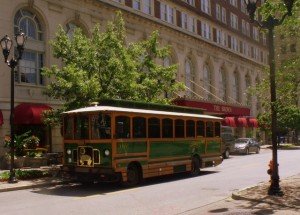 Brown Hotel With Tram Outside