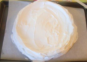 Uncooked pavlova on baking sheet