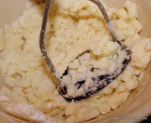 Mashing potato and flour together for tatty scone