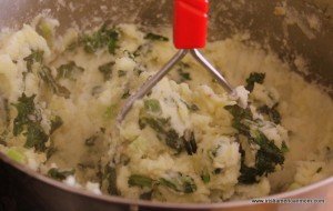 Masing potato and kale for colcannon
