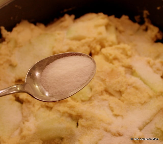 Sprinkling sugar on Kerry Apple Cake