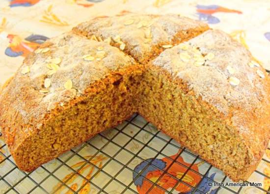 A loaf of Irish brown bread with a quarter farl cut away | Irish American Mom A loaf of Irish brown bread with a quarter farl cut away
