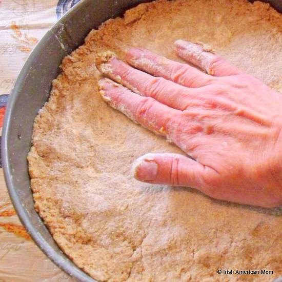 Forming brown bread dough into a baking pan | Irish American Mom Forming brown bread dough into a baking pan