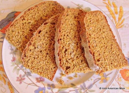 Slices of freshly cut Irish brown soda bread on a plate | Irish American Mom Slices of freshly cut Irish brown soda bread on a plate