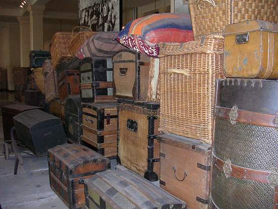 The Baggage Room - old suitcases and trunks | Irish American Mom Suitcases, trunks and wicker traveling cases in a stack