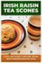 Banner advertising Irish raisin tea scones: a raisin scone on a colorful plate beside a striped mug of tea on a shamrock-patterned table, with bottom text crediting IrishAmericanMom.com.