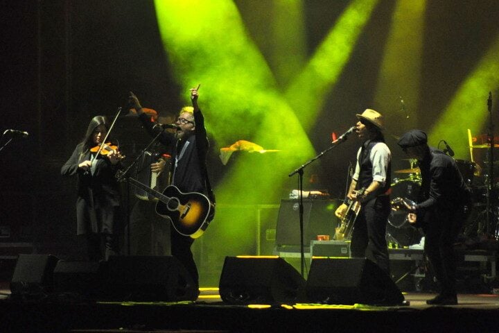 Band on stage with green lighting