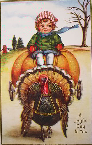 vintage boy driving a pumpkin carriage with a turkey