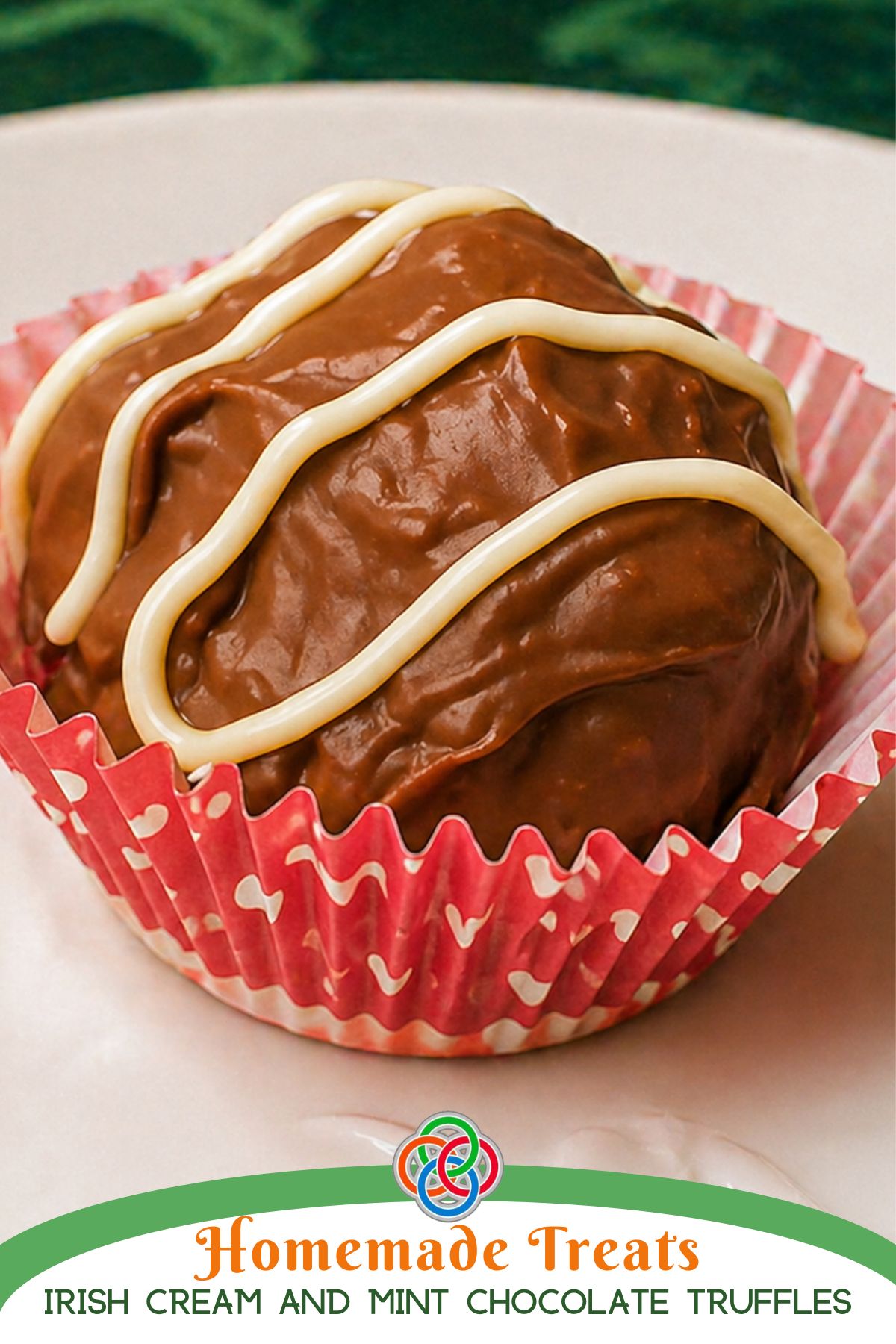 Close-up of a chocolate truffle in a pink striped cupcake liner with white chocolate drizzle, with text banner stating Homemade Treats Irish Cream and Mint Chocolate Truffles.