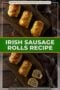 Golden flaky Irish sausage rolls arranged on a wooden board, with one cut open to reveal the savory meat filling, styled on a rustic table with a cloth backdrop with central text banner.