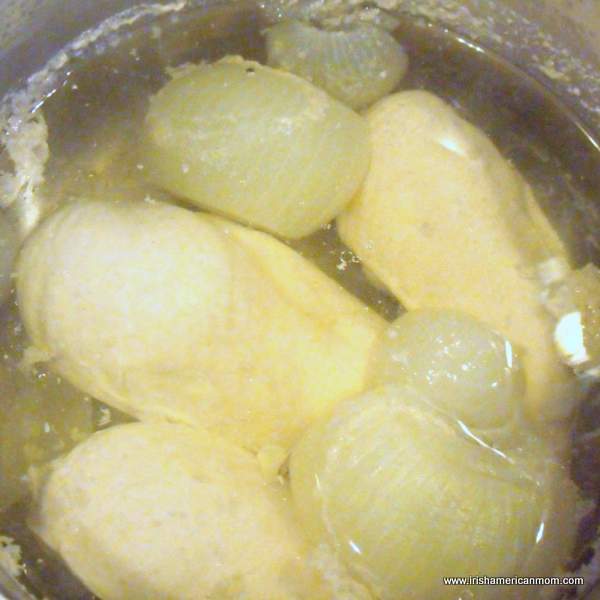 Poached chicken in simmering liquid | Irish American Mom Poached chicken in simmering liquid