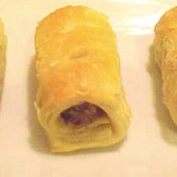 A puff pastry Irish sausage roll on a plate