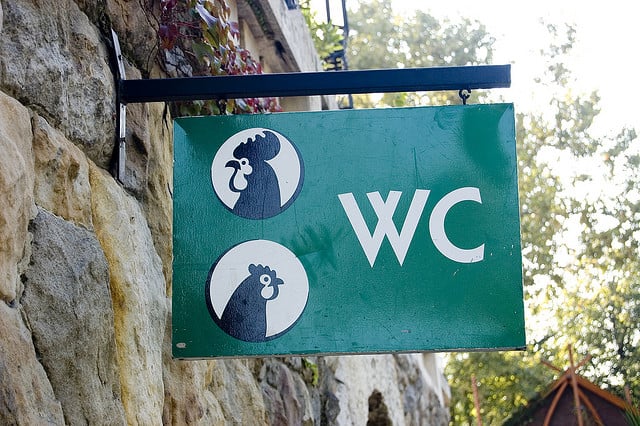 Toilet sign with a hen and rooster