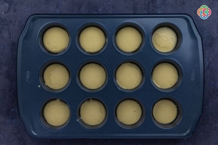 Filling muffin tray with batter for yorkshire pudding | Irish American Mom Batter in a muffin tin