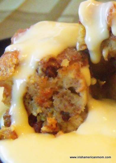 Bread pudding with hot custard | Irish American Mom Hot custard sauce poured over a serving of cinnamon raisin bread pudding