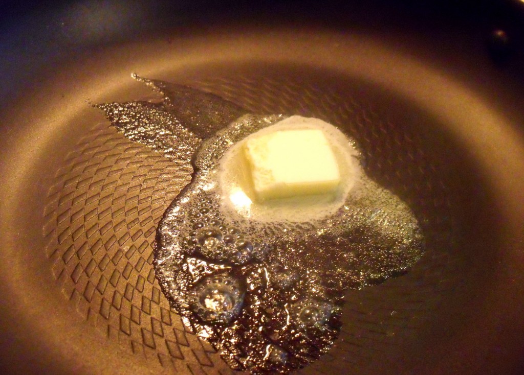Butter Melting In Pan Melting knob of butter in a frying pan