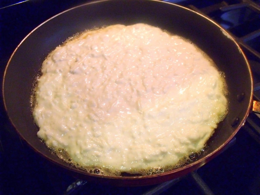 Boxty Batter In The Pan Potato pancake batter cooking in a frying pan for boxty