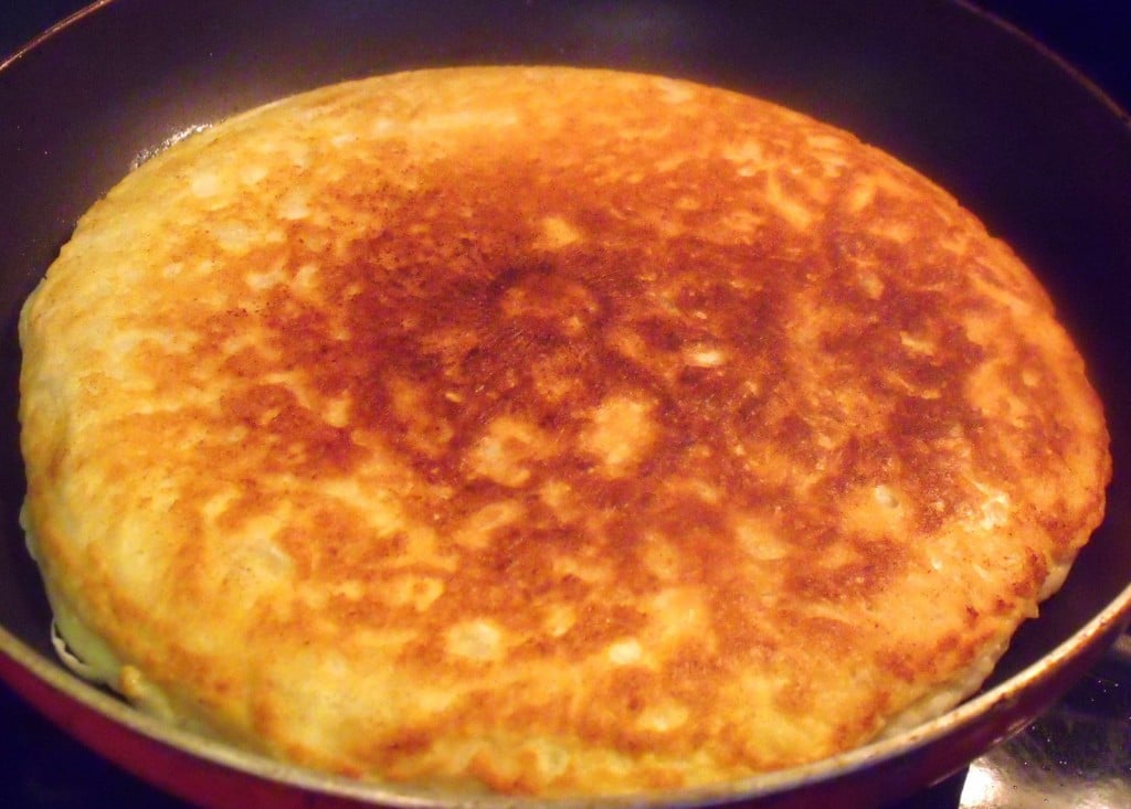 Boxty Cooked On One Side Brown cooked side of a boxty potato pancake in a pan