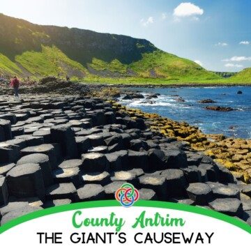 Hexagonal pillars by the ocean with text banner