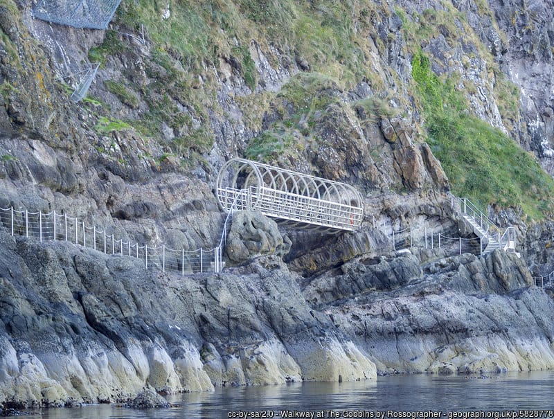 Gobbins Cliffside Path in County Antrim | Irish American Mom An iron bridge connects a railed walkway along cliffs
