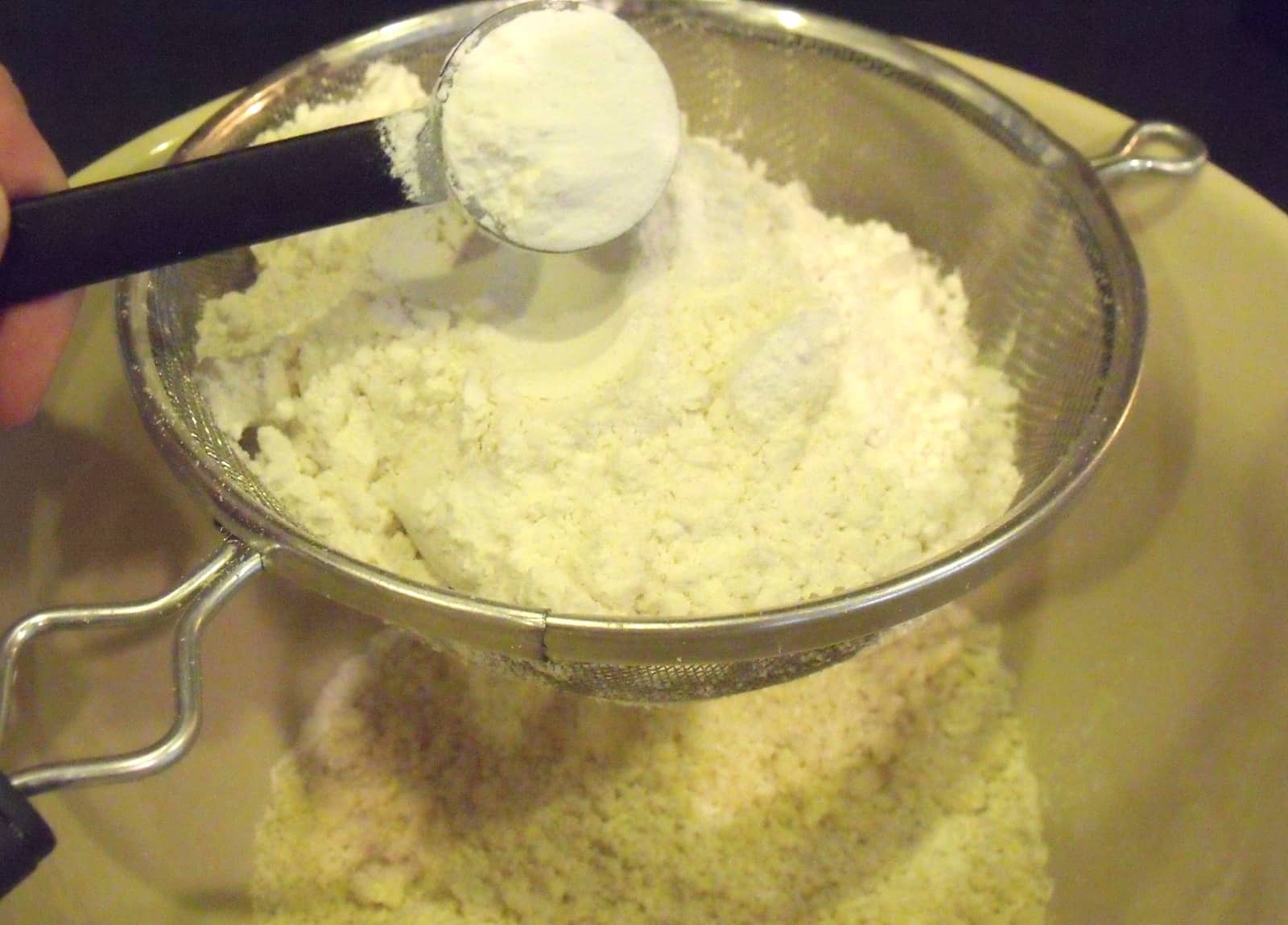 Sifting flour, salt and baking powder Irish American Mom