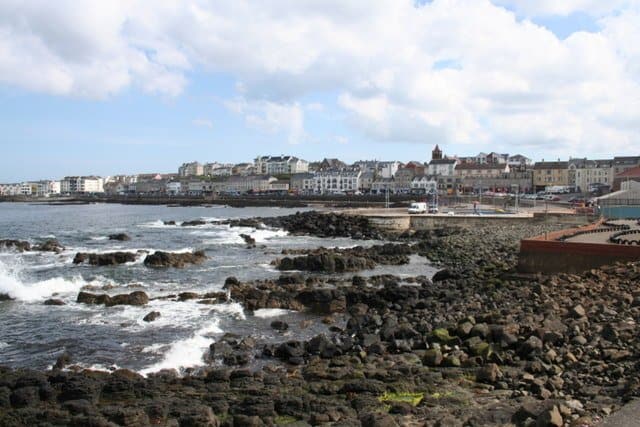 The promenade at Portstewart | Irish American Mom Waves by the rocky shore and promenade in Portstewart, County Derry, Northern Ireland