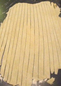 Cutting strips of pastry for hot cross buns