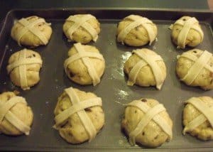 Pastry crosses across the top of unbaked hot cross buns
