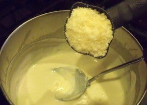 Adding cheese to mornay sauce for a Kentucky Hot Brown Sandwich
