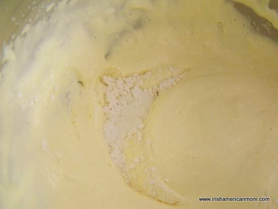 Folding flour into a sponge mixture