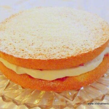 Cream and jam filled Irish sponge cake with a dusting of confectioner's or icing sugar