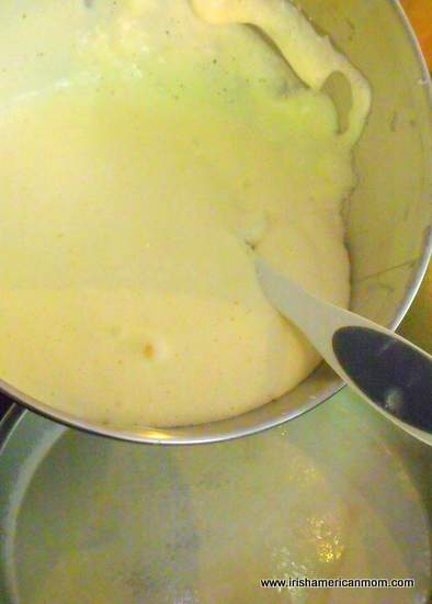 Pouring sponge cake batter into a baking pan