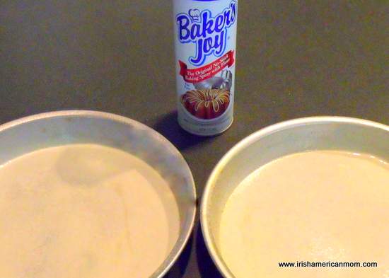 Preparing baking tins for a sponge cake