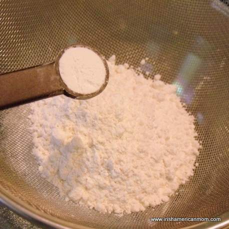 Sifting flour for a sponge cake