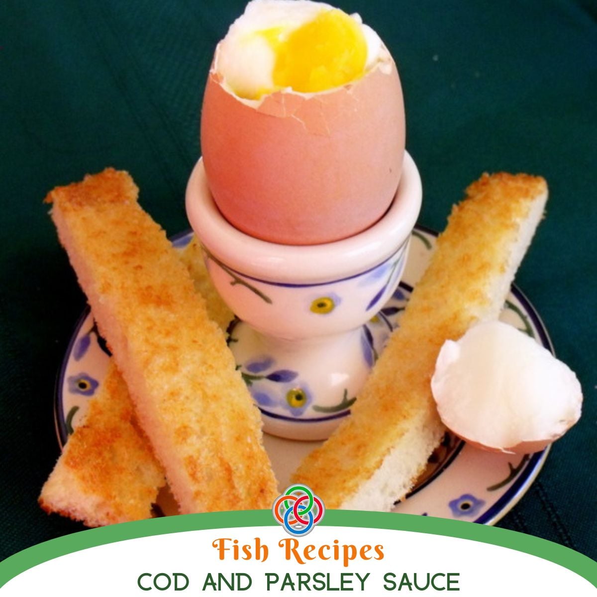 Soft boiled egg in an egg cup with a runny yolk, served with toasted bread soldiers on a small plate, ready for dipping.