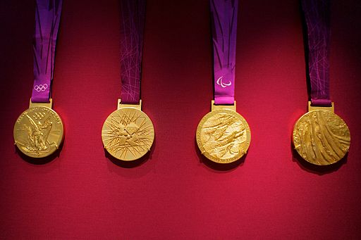 Four gold medals on ribbons