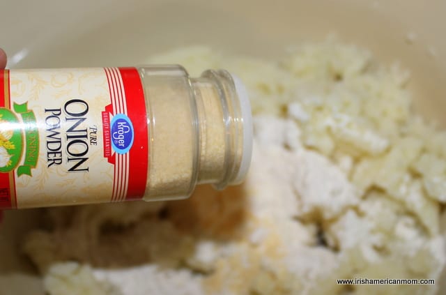 Adding onion powder to potato cakes | Irish American Mom Adding onion powder into mashed potatoes and flour for potato cake dough