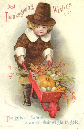 A pilgrim boy pushes a wheelbarrow with pumpkins and squash on a vintage Thanksgiving greeting card