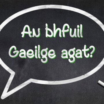 Text in a thought bubble on a black surface