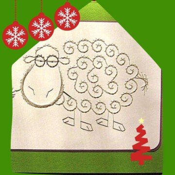Emboidered sheep design on a Christmas card graphic
