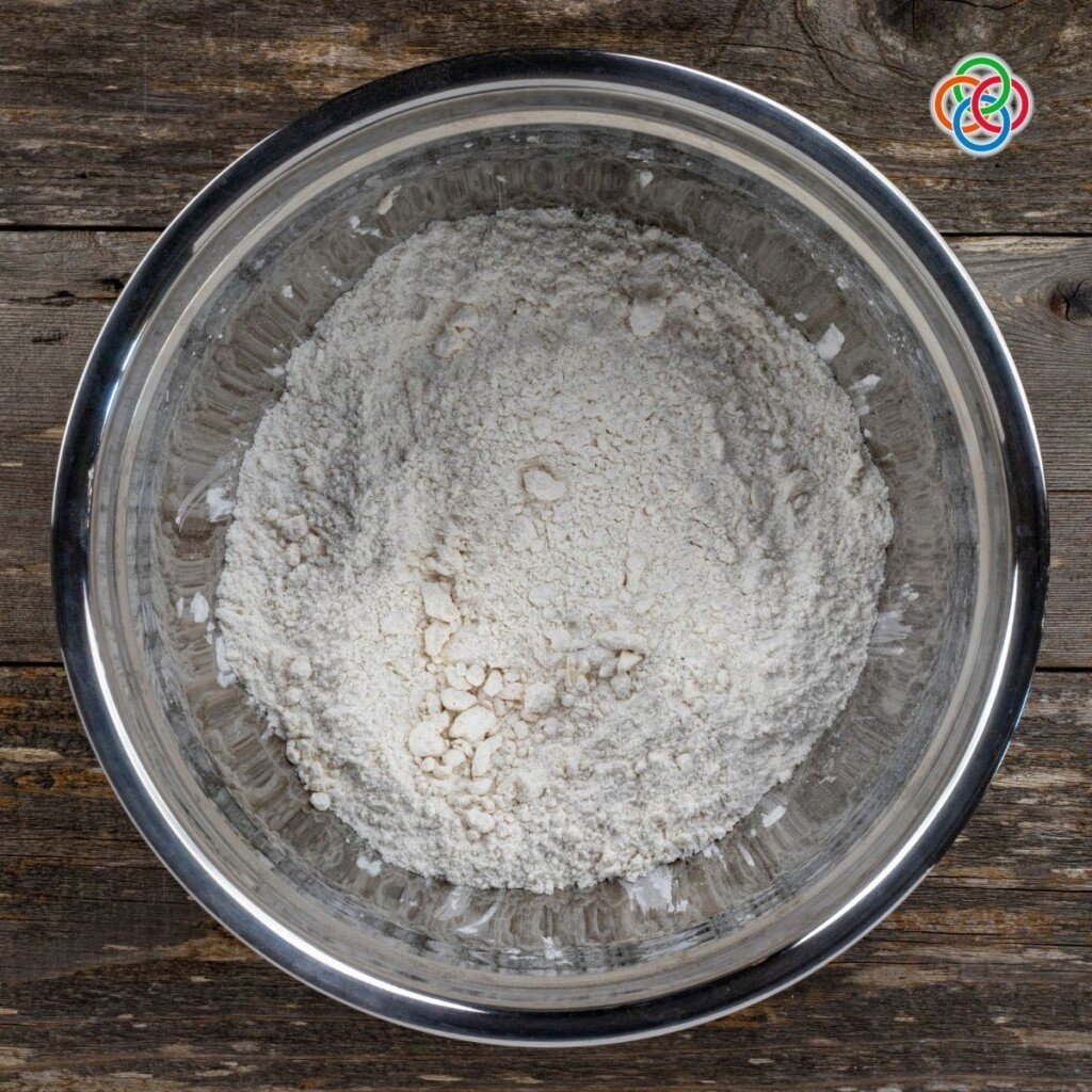 Adding Butter to Flour for Irish Apple Cake Butter and flour rubbed together in a bowl
