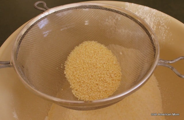 Ground Almonds in a sifter | Irish American Mom adding ground almonds to a pie crust