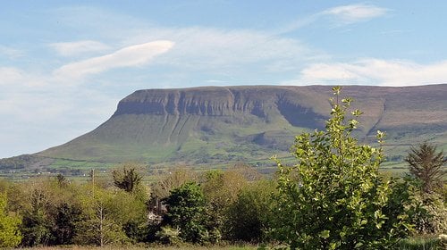 Ben Bulben | Irish American Mom sun shining on a table shaped mountain