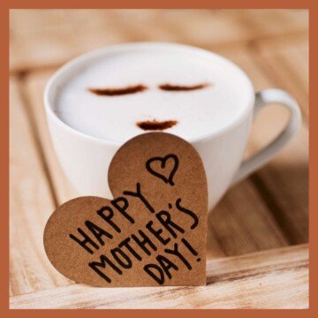 Heart with text beside a cup of coffee