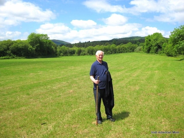Irish Farmer In A Field | Irish American Mom A man standing in a grassy field