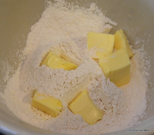 Cutting butter into flour for streusel topping | Irish American Mom butter knobs in flour for lemon blueberry crumb cake
