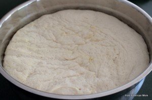 A metal bowl full of risen Irish potato bread yeast dough