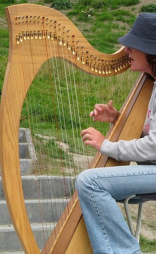 Irish Harp | Irish American Mom Irish Harp being played by a girl in hat