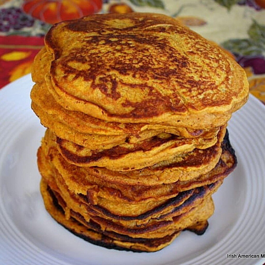 Stack of pumpkin pancakes on a plate | Irish American Mom Stack of pumpkin pancakes